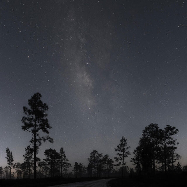 Stunning naked-eye view of the Milky Way band arching over a remote dark sky location.