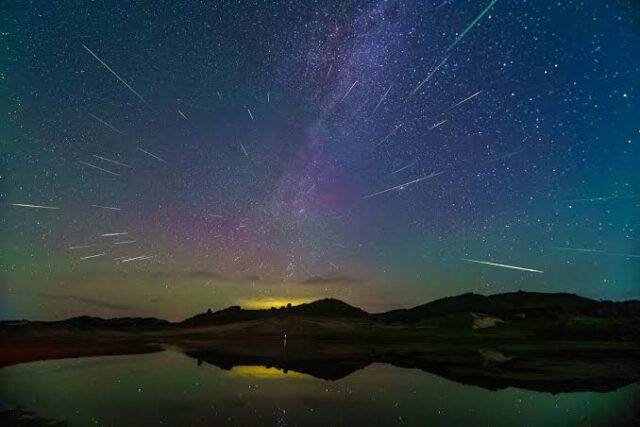 Perseid meteors blazing through the summer Milky Way during peak annual activity.